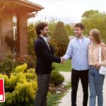 Millennial couple shaking hands with real estate agent near their new house outdoors, copy space